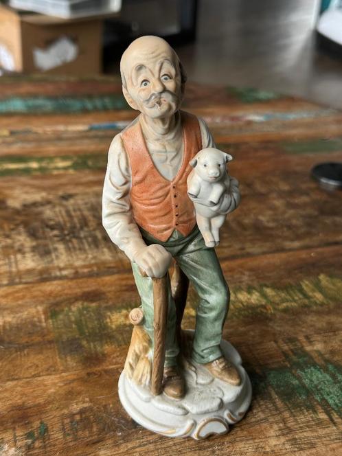Porseleinen beeldje van man met varken, Merk Inarco, Antiek en Kunst, Antiek | Porselein, Ophalen of Verzenden
