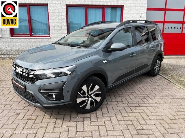 Dacia Jogger 1.6 Hybrid 140 Expression 7p., Auto's, Dacia, Stof, Gebruikt, Zwart, 4 cilinders