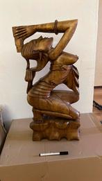 Houten beeld, Ophalen