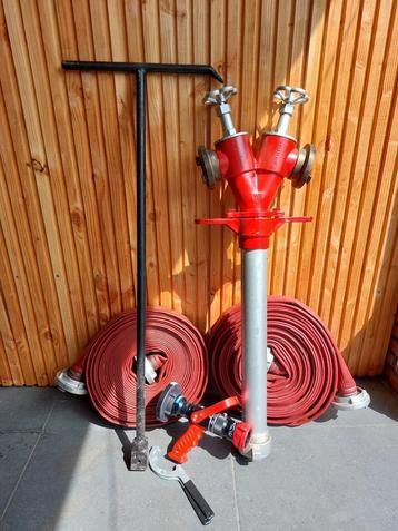 Te koop, complete set brandweerslangen, spuitkop en meer..  beschikbaar voor biedingen