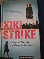 K. Miller - Kiki Strike, Ophalen of Verzenden, Zo goed als nieuw, K. Miller