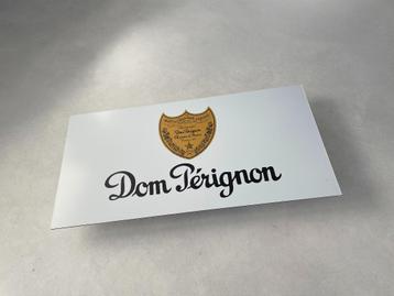 Reclamebord Dom Pérignon logo 59,5x29,5cm aluminium beschikbaar voor biedingen