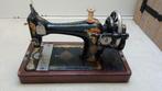 Oude Singer naaimachine, Ophalen