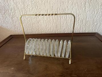 Vintage houder met Leerdam onderzetters 1960/70 beschikbaar voor biedingen