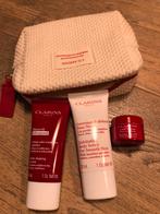 Clarins toilettasje met 3 verzorgingsproducten., Ophalen of Verzenden, Nieuw, Overige typen