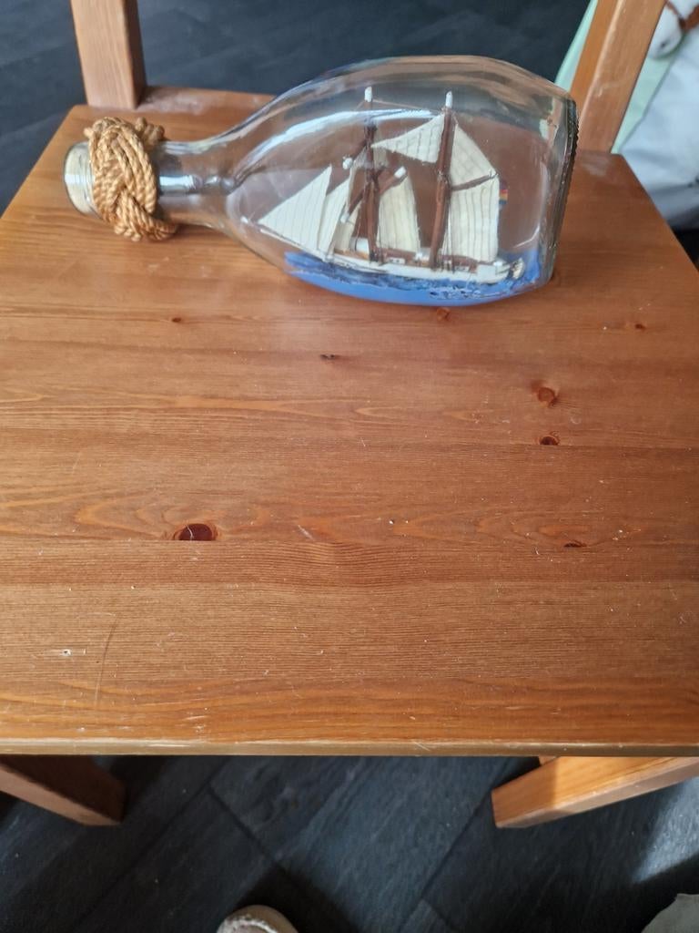 Fles met bootje., Ophalen