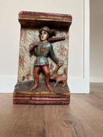 Houten beeld van jager met hond, Ophalen