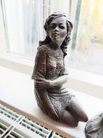 Beeldje vrouw, Ophalen