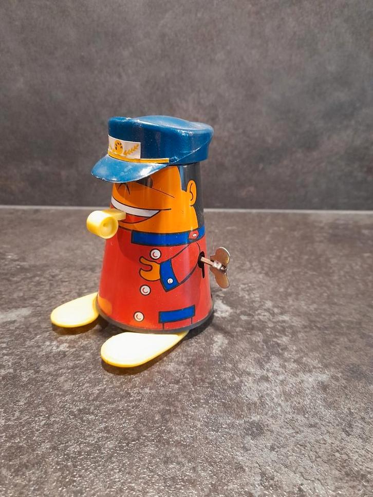 Blikken speelgoed conducteur met fluit, Antiek en Kunst, Antiek | Speelgoed, Ophalen of Verzenden