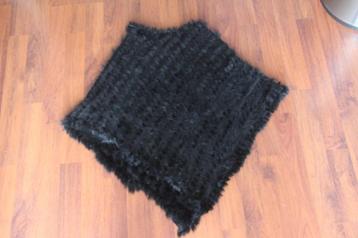 poncho zwart beschikbaar voor biedingen