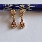 Goudkleurige oorbellen met bruine Swarovski elementen, Met kristal, Overige materialen, Hangers, Verzenden