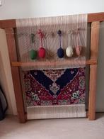 Perzisch kleedje op weefgetouw, Ophalen