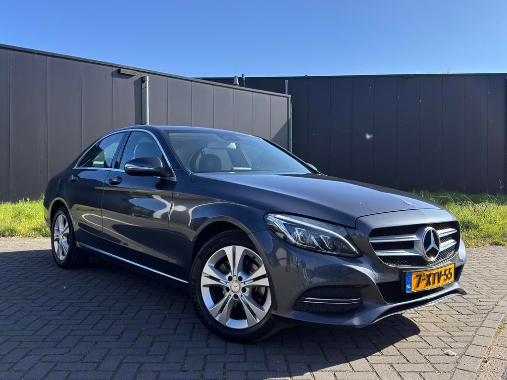 Mercedes-Benz C-Klasse C180 1.6 115KW Aut7 2014 Grijs, Automaat, 1800 kg, Leder en Stof, Particulier