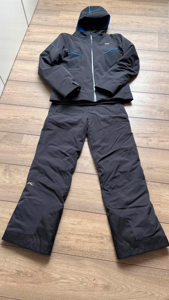 In zeer nette staat zwarte skijas en skibroek Kjus mt 164, Kinderen en Baby's, Kinderkleding | Maat 164, Zo goed als nieuw, Jongen