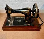 Antiek naaimachine, Ophalen