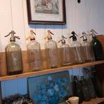 7 oude spuitflessen, Ophalen