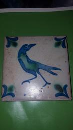 Antiek tegeltje met vogel, Ophalen