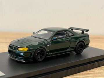 Nissan Skyline GT-R R34 NISMO dark green motorhelix 1:64 beschikbaar voor biedingen