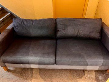 Grijze bank - Gebruikt beschikbaar voor biedingen