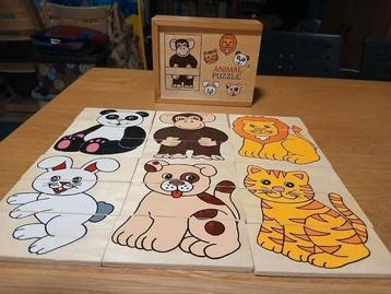 Houten box met zes houten drie delige puzzelstukjes dieren  beschikbaar voor biedingen