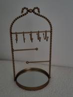 Nieuw een gouden sieradenrekje met een strik ., Ophalen of Verzenden, Zo goed als nieuw