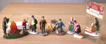 7 Lemax  figuren waarvan één met mogelijkheid verlichting beschikbaar voor biedingen