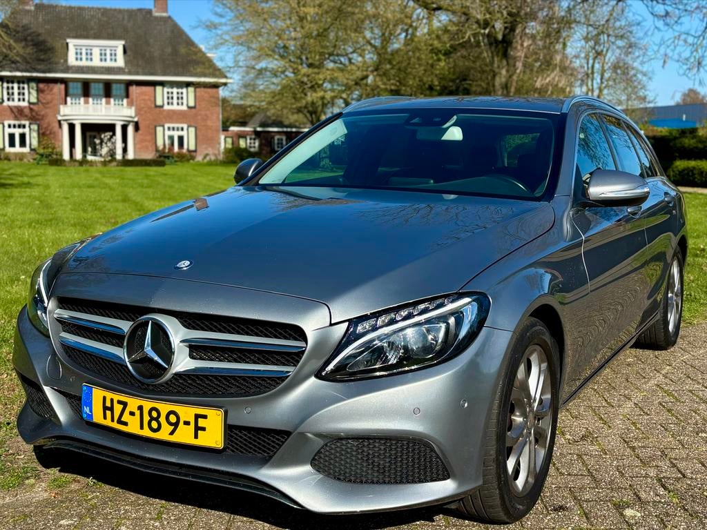 Mercedes-Benz C-Klasse 1.6 C180 Estate 2015 elektr Trekhaak, Auto's, Mercedes-Benz, Automaat, Achterwielaandrijving, 1800 kg, Leder en Stof