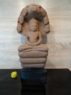 Zwaar stenen Naga beeld, Ophalen