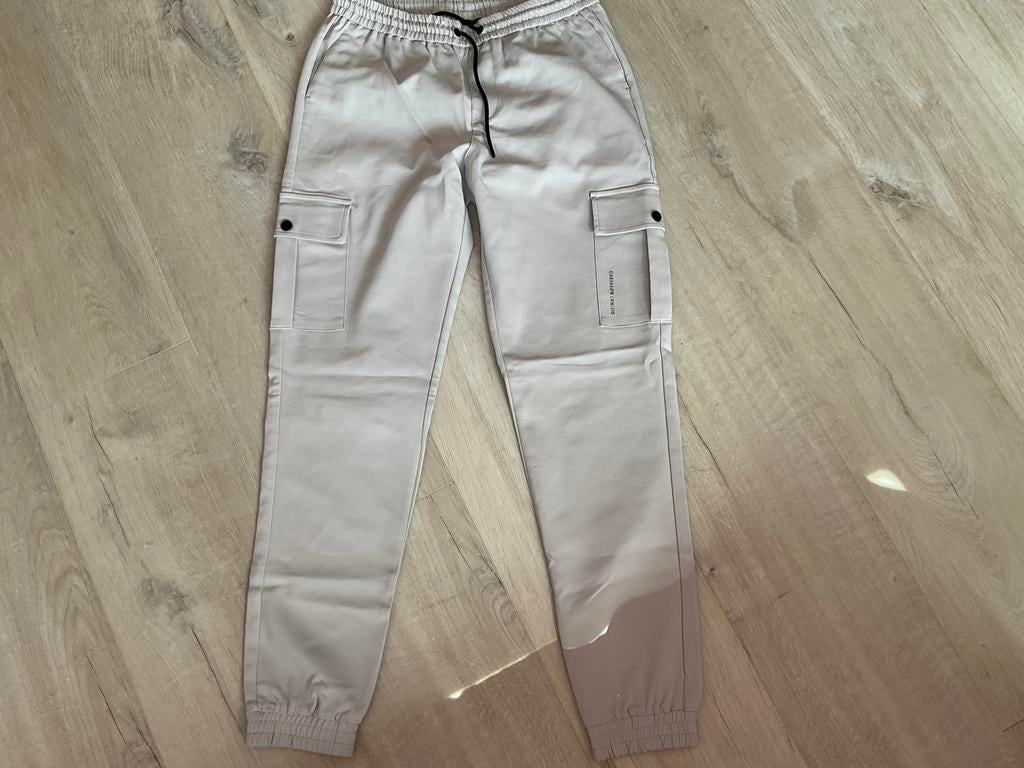 DISTRIKT Heren / jongens Cargo Broek - Maat S, Kleding | Heren, Ophalen of Verzenden, Nieuw, Maat 46 (S) of kleiner, Grijs