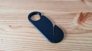 Sleutelhanger met hondenpoepzakje beschikbaar voor biedingen