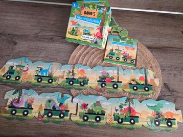 Dino puzzeltrein met bijbehorend boek beschikbaar voor biedingen