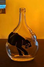 Prachtige fles met poema, Ophalen