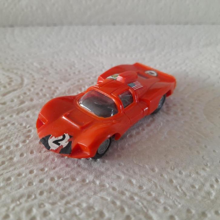 Champion Chapparal 2D oranje, Hobby en Vrije tijd, Modelauto's | Overige schalen, Gebruikt, Auto, Ophalen of Verzenden