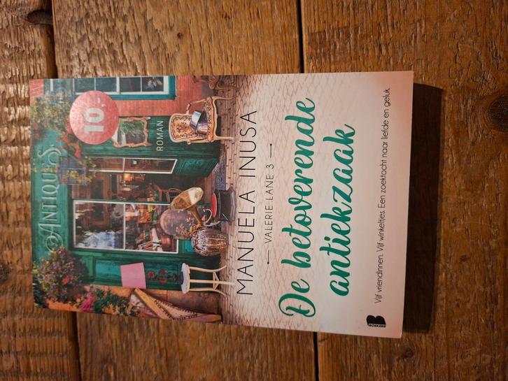 Manuela Inusa - De betoverende antiekzaak, Boeken, Literatuur, Zo goed als nieuw, Ophalen of Verzenden
