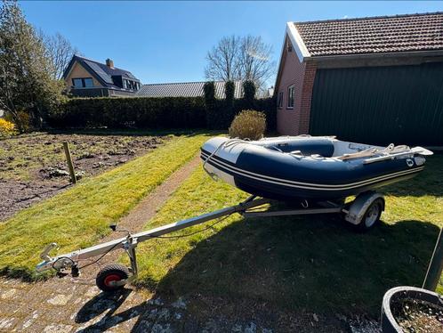 Rubberboot met 4pk moter, Watersport en Boten, Rubberboten, Gebruikt, Overige merken, Hout, Minder dan 70 pk, Benzine, Ophalen