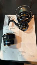 Te koop nieuwe Saltiga 10.000 molen met extra spoel, Watersport en Boten, Ophalen of Verzenden, Zo goed als nieuw, Molen