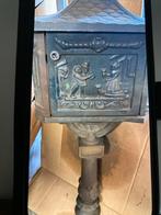 Antieke gietijzeren brievenbus, Ophalen