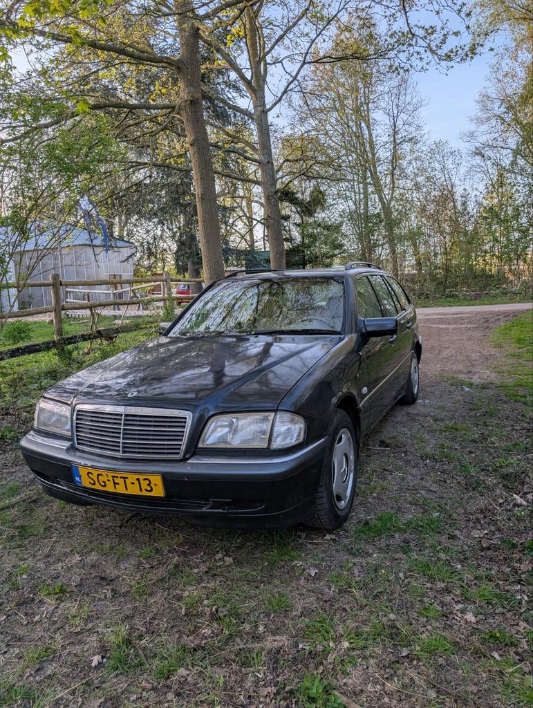 Mercedes-Benz C-Klasse 1.8 C180 Combi 1997 Donkerblauw, Auto's, Mercedes-Benz, Beige, 4 cilinders, 1799 cc, Zwart