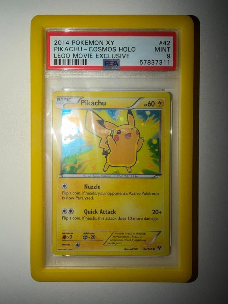 PSA 9 Pikachu Cosmos Holo Lego Movie Exclusive Promo, Ophalen of Verzenden, Zo goed als nieuw, Losse kaart, Foil