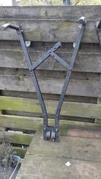 Schaar fietsendrager, Ophalen