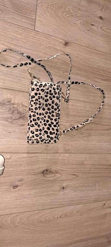 Leuke portemonnee met luipaardprint beschikbaar voor biedingen