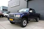 Toyota HiLux 2.4 4WD Xtra cabine 4X4 Grijs kenteken, Auto's, Toyota, Stof, Gebruikt, 4 cilinders, Origineel Nederlands