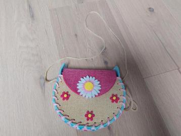 Kindertasje (vrijwel nieuw) beschikbaar voor biedingen