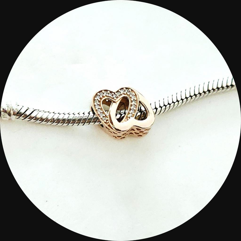 Pandora rose goud entwined Hearts 781880CZ / retired  harten, Pandora, Ophalen of Verzenden, Zo goed als nieuw, 1 bedel