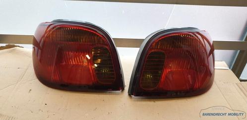 Achterlichten set VITZ Toyota Yaris I Koito Topsport origine, Auto-onderdelen, Verlichting, Toyota, Gebruikt, Ophalen of Verzenden