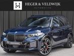 BMW X5 xDrive50e M-SPORT PRO | PANORAMADAK | ACHTERAS BESTUR, Gebruikt, 2395 kg, Met garantie (alle), Blauw