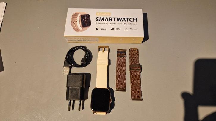 Smartwatch Avalue in doos met oplader en 2 bandjes, Sieraden, Tassen en Uiterlijk, Smartwatches, Zo goed als nieuw, Android, Roze
