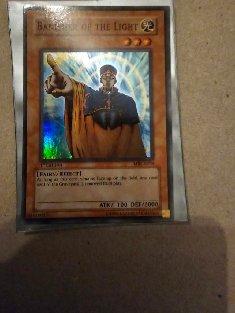 Yu-Gi-Oh! Banisher of the Light (1st Edition) MRL-E075, Ophalen of Verzenden, Zo goed als nieuw, Losse kaart, Foil
