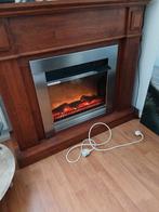 Elektrische haard met houten ombouw, Ophalen