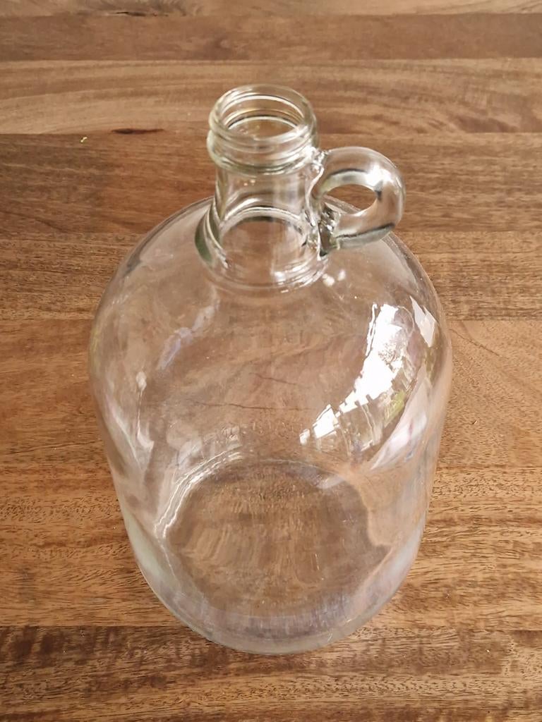 Grote vintage glazen one gallon fles met oortje, Ophalen of Verzenden